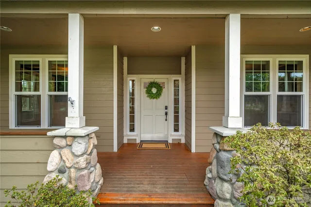 a front view of a house with outdoor seating