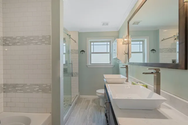 a bathroom with a sink a mirror and a bathtub