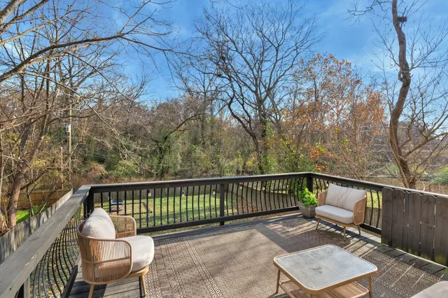 a view of a chair and table on the wooden floor