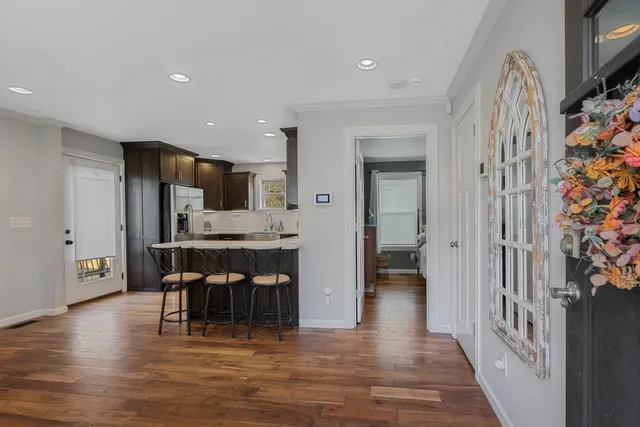 a view of a kitchen from the hallway