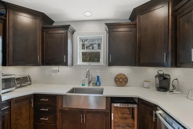 a kitchen with a sink and cabinets