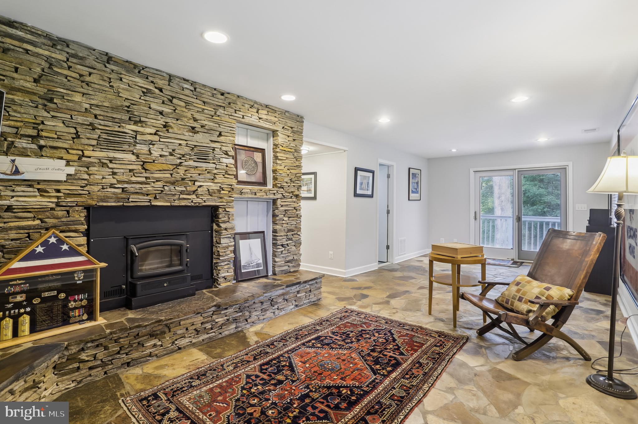 27 Wilelinor Drive Edgewater, MD 21037 - Photo 29 of 35 Family Room with wood stove, bath and deck access