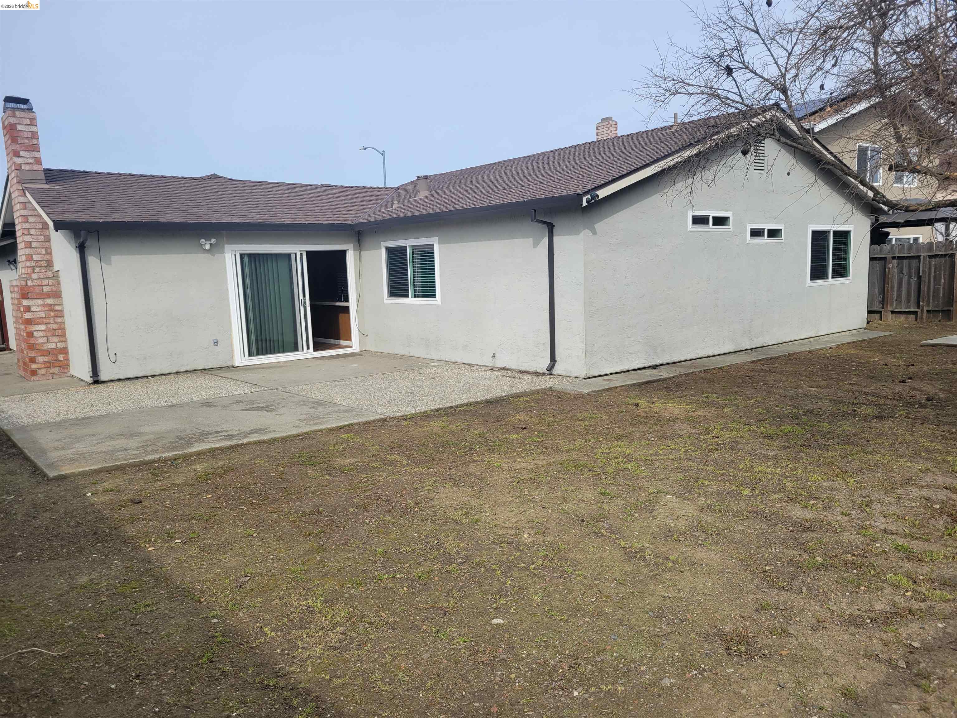 906 Coral Drive Rodeo, CA 94572 - Photo 17 of 21 a view of an house with backyard and parking