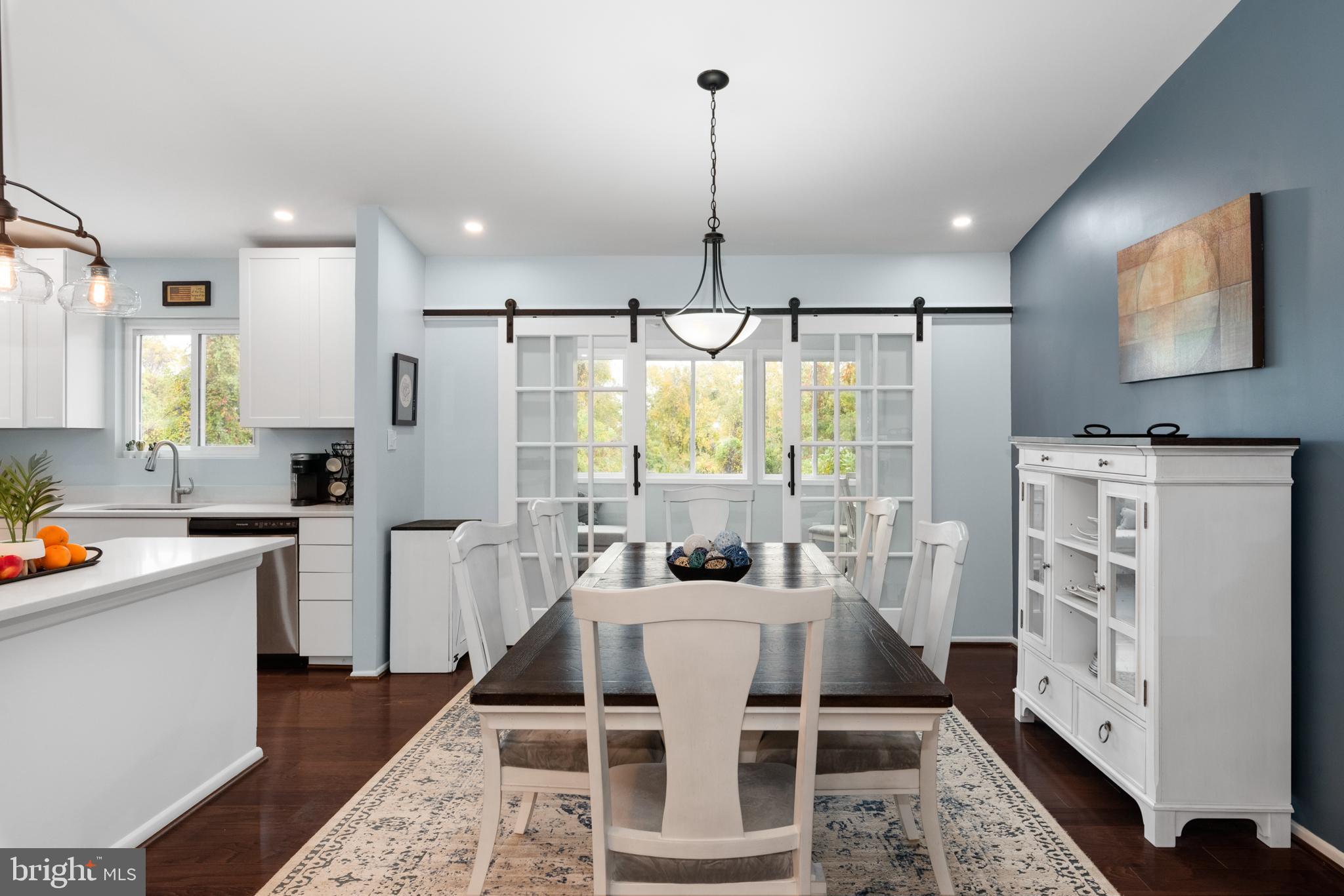 631 Truxton Road Annapolis, MD 21409 - Photo 14 of 61 a kitchen with stainless steel appliances kitchen island granite countertop a refrigerator a sink a stove and white cabinets with wooden floor