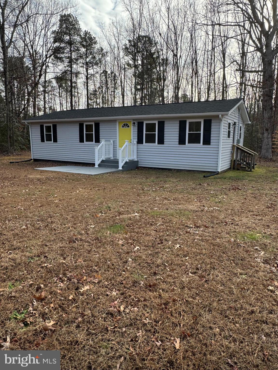 front view of a house with a yard