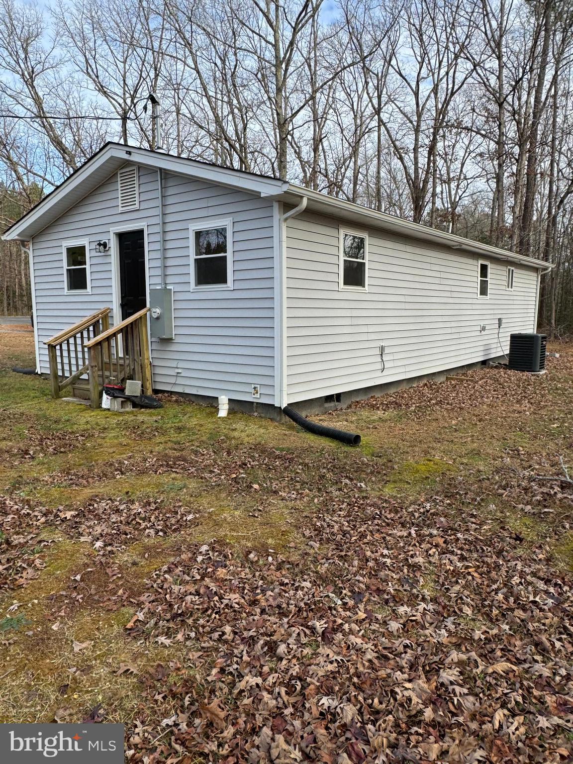 7178 Jericho Road Ruther Glen, VA 22546 - Photo 17 of 18 a view of a house with a yard