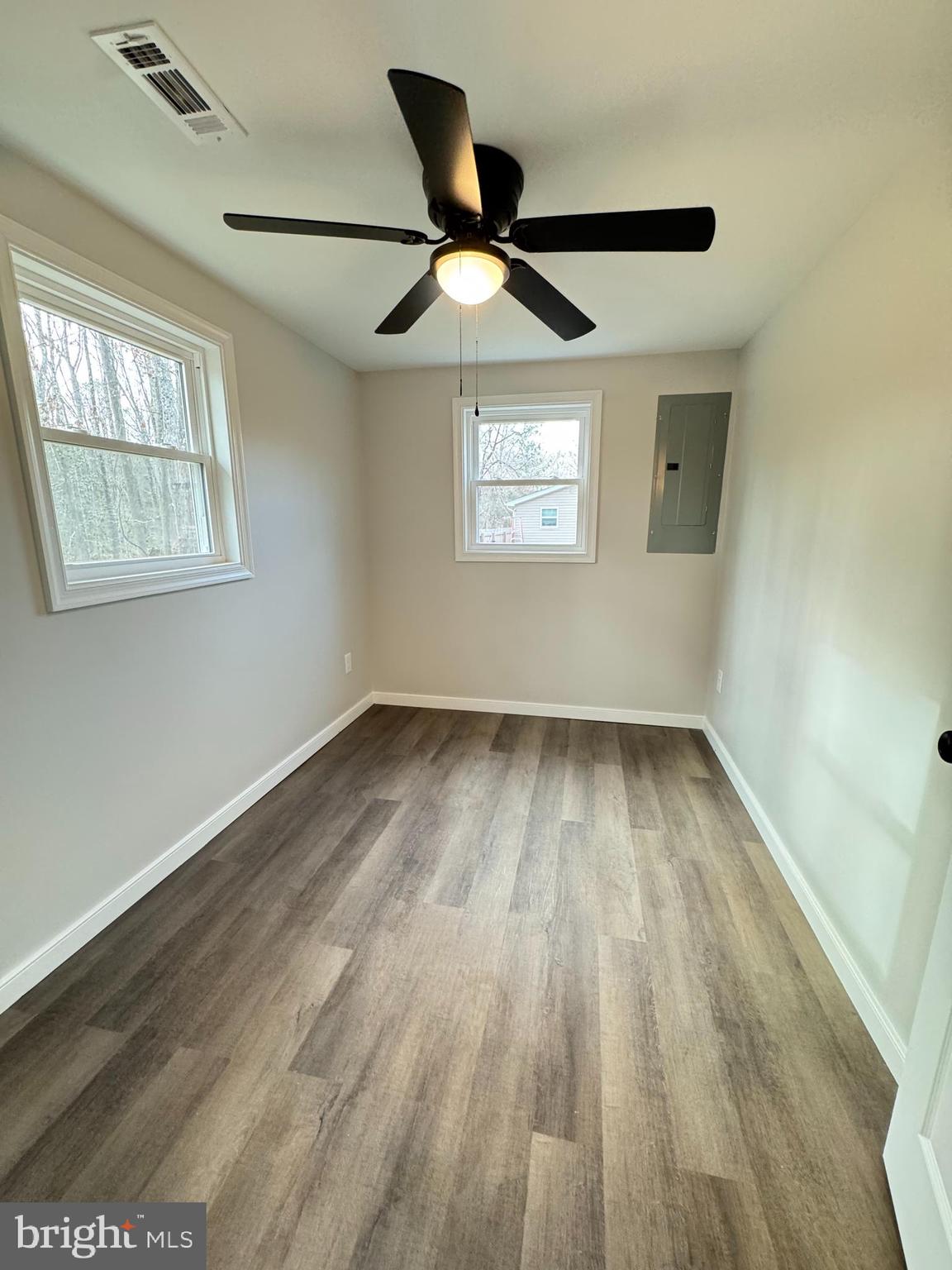 7178 Jericho Road Ruther Glen, VA 22546 - Photo 7 of 18 wooden floor in an empty room with a window