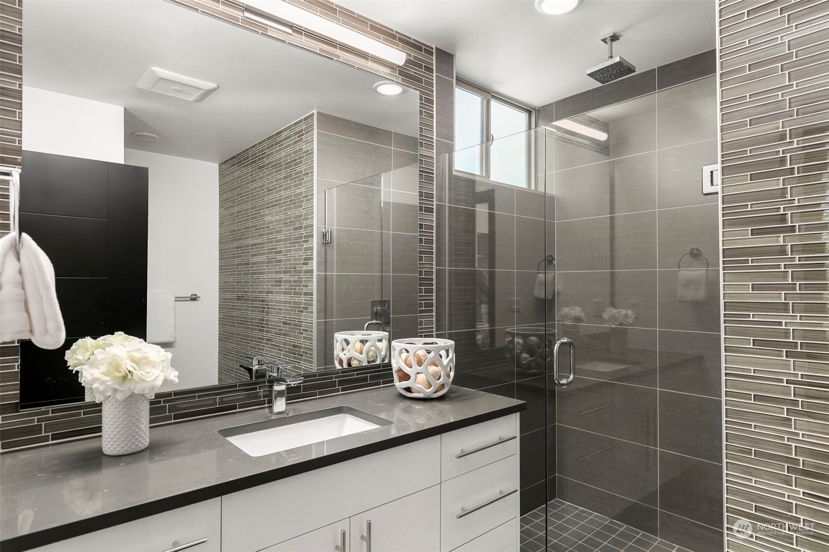 200 20th Avenue South Seattle, WA 98144 - Photo 13 of 22 a bathroom with a granite countertop sink a toilet and shower