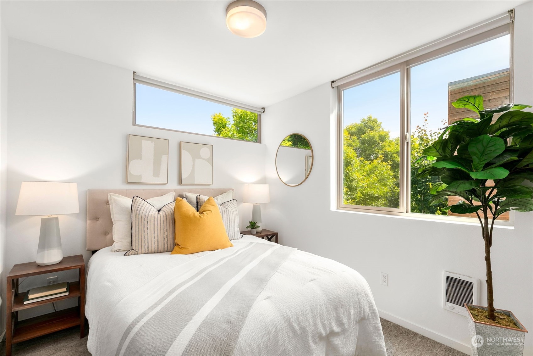 200 20th Avenue South Seattle, WA 98144 - Photo 8 of 22 a bedroom with a bed mirror and a window