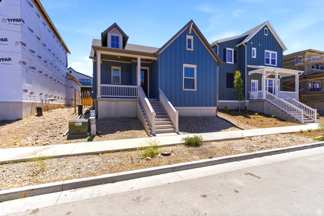 7243 West Terraine Road West Jordan, UT 84081 - Photo 2 of 31 Modern farmhouse-style residence featuring blue siding and white trim