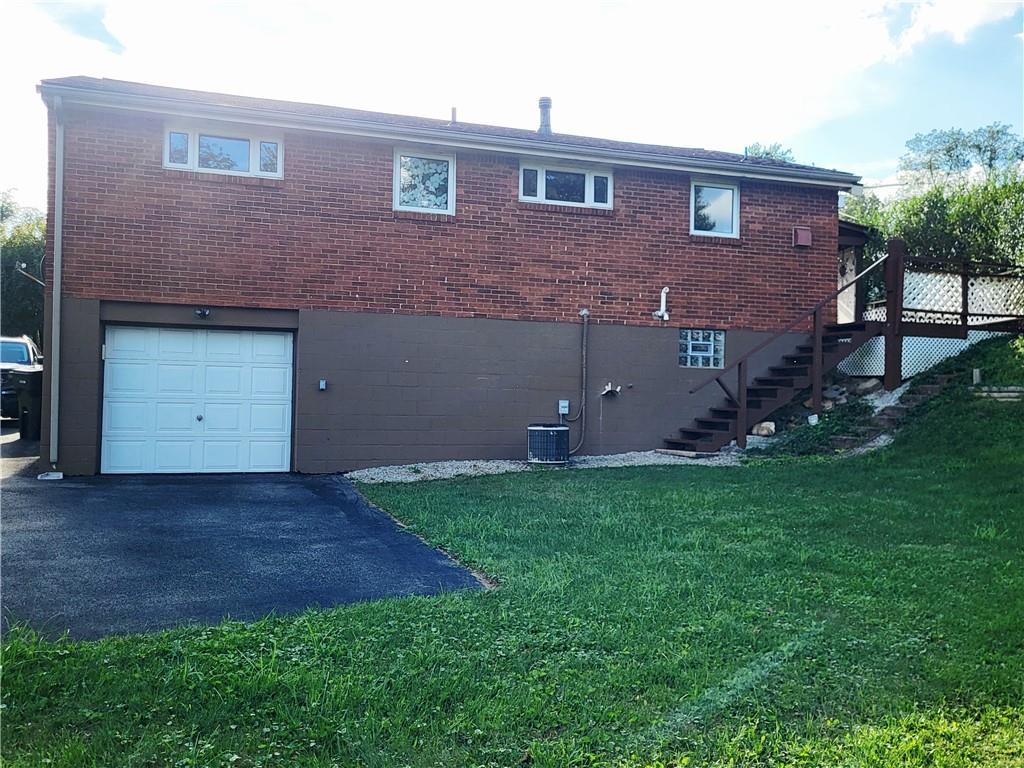 685 Pettigrew Road Irwin, PA 15642 - Photo 3 of 32 The rear of the home showing one car integral garage