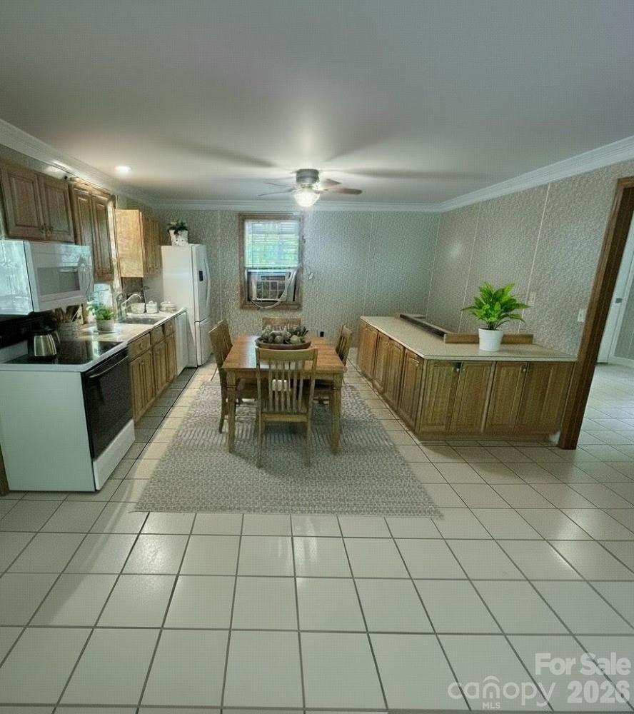 2051 Sutton Spring Road York, SC 29745 - Photo 23 of 47 a kitchen with a sink a counter top space and appliances