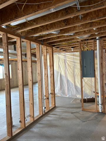 175 North 100th West Centerfield, UT 84622 - Photo 29 of 32 Unfinished basement featuring exposed wood framing, concrete flooring, and visible electrical wiring. Lighting is wired.