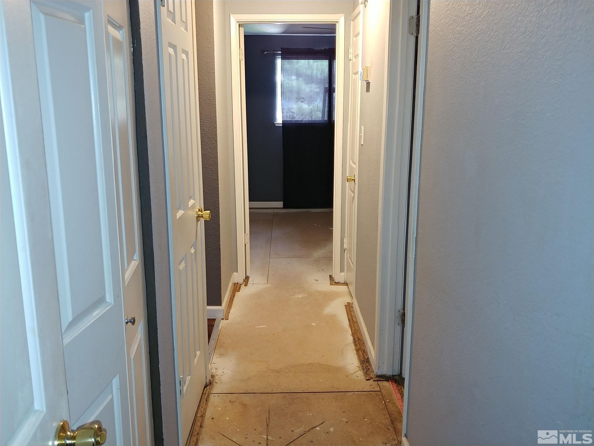 6615 Lotus Street Reno, NV 89506 - Photo 10 of 16 a view of a hallway with wooden floor