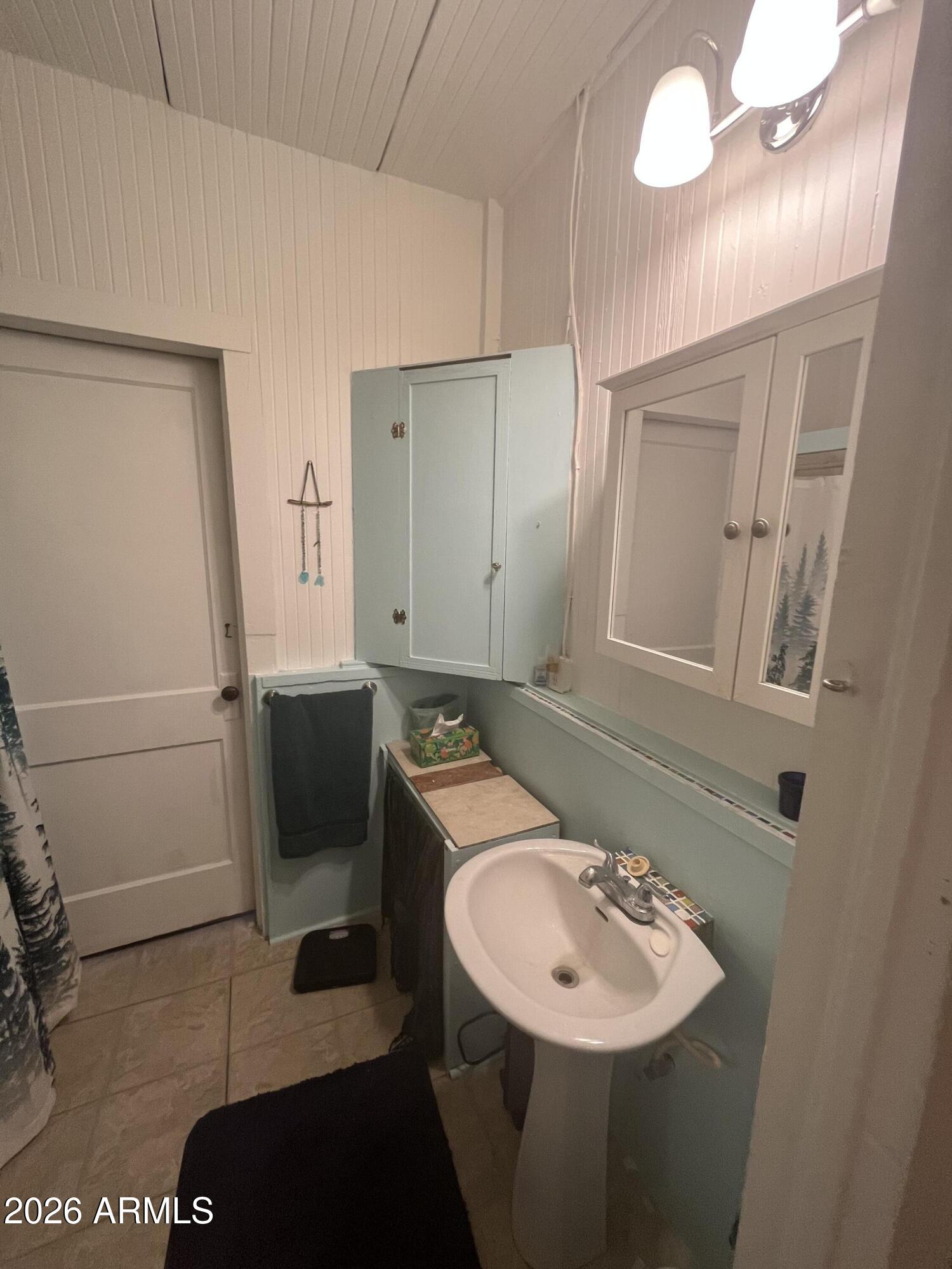 640 West Rocalla Avenue Ajo, AZ 85321 - Photo 10 of 27 a bathroom with a sink and a mirror