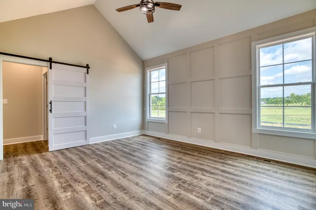 a bathroom with double vanity sink and a mirror