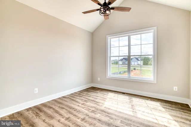 a bathroom with a double vanity sink toilet mirror and bathtub