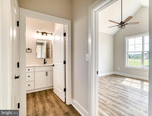 an empty room with a empty space and windows