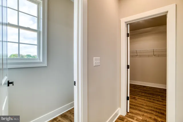 a view of storage and utility room with washer and dryer