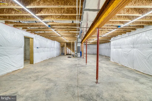 a view of a swimming pool with a lawn chairs under an umbrella