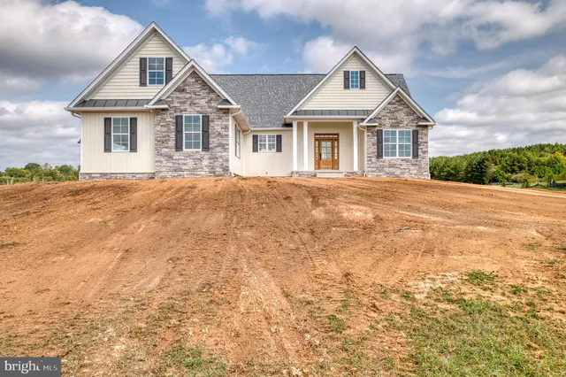 a view of a swimming pool with a yard