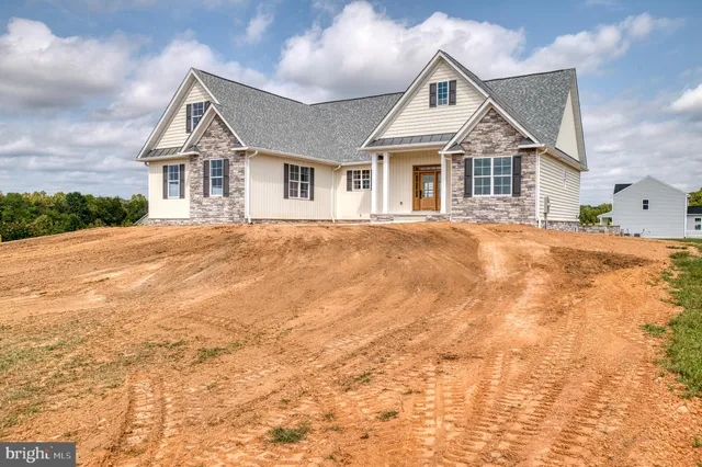 a view of a lake with houses in background