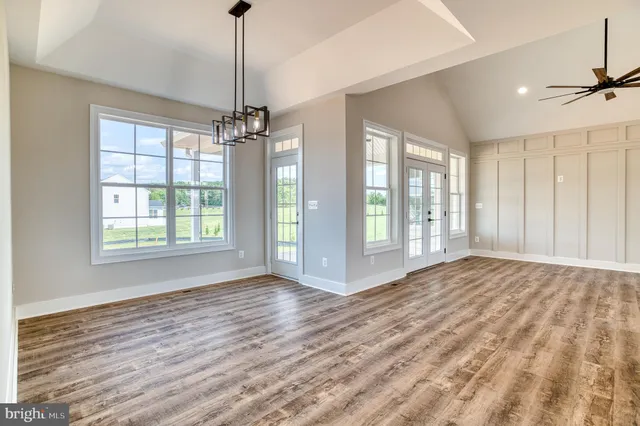 a view of a room with window wooden floor and cabinet