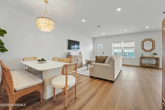 a living room with furniture a window and a table