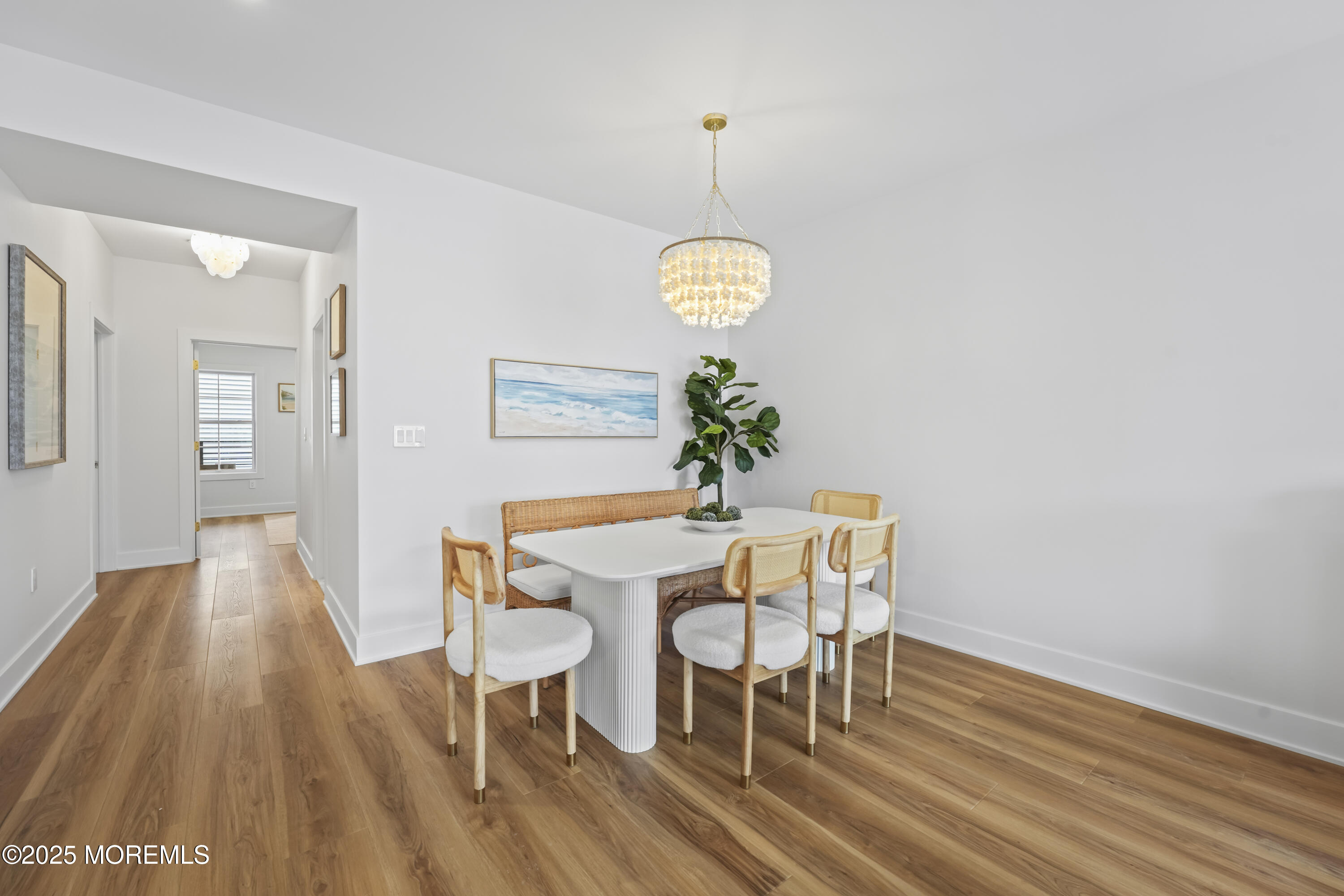 33 Hamilton Avenue, Unit 2 Seaside Heights, NJ 08751 - Photo 12 of 32 a view of a dining room with furniture and wooden floor