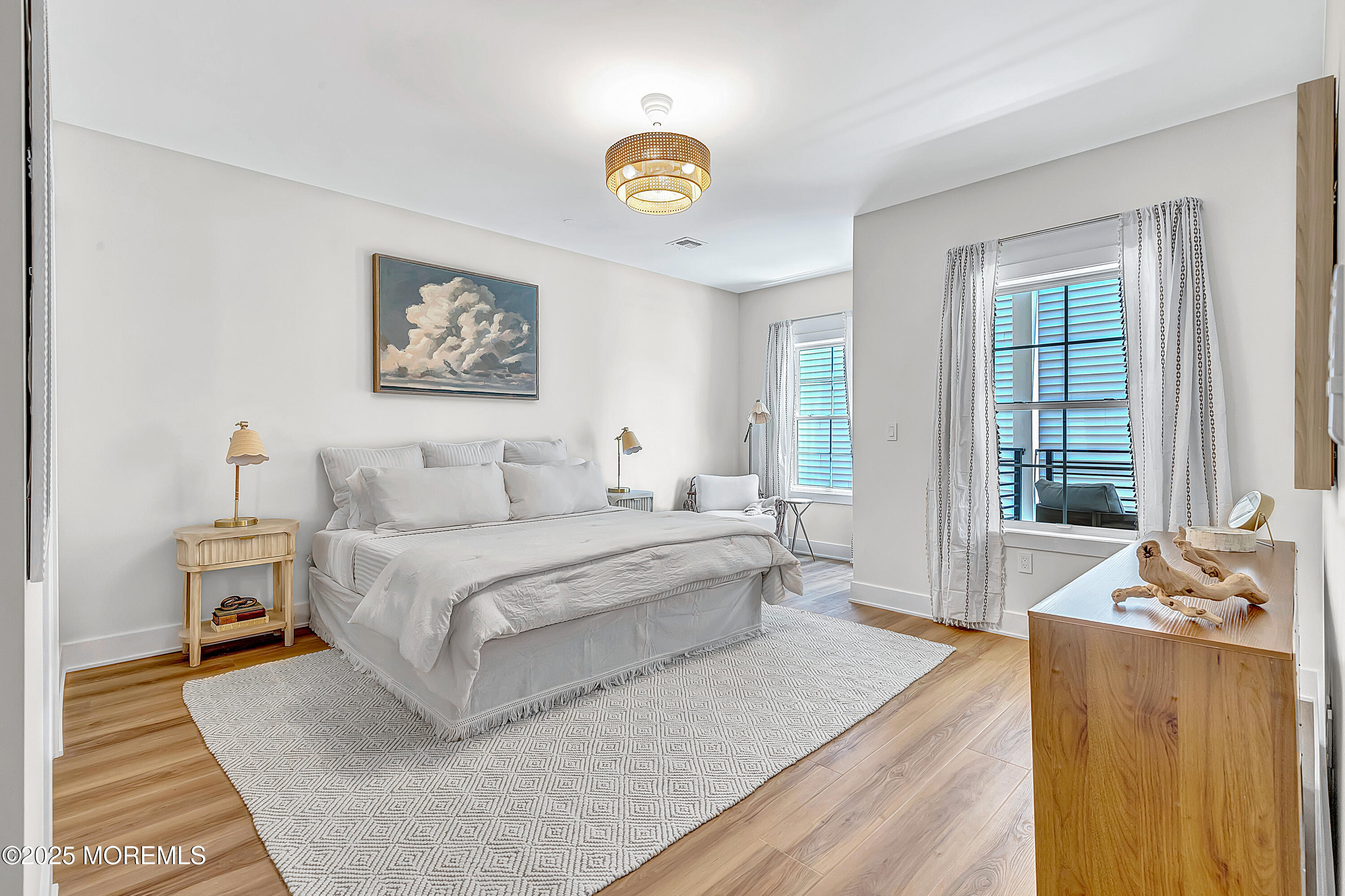 33 Hamilton Avenue, Unit 2 Seaside Heights, NJ 08751 - Photo 15 of 32 a spacious bedroom with a bed a couch and a window