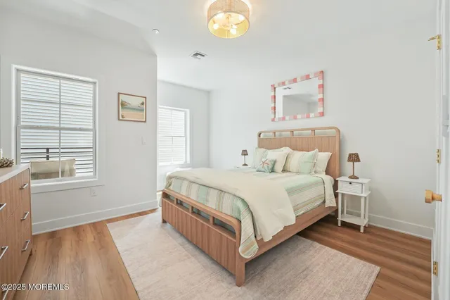 a bed room with a bed and a window