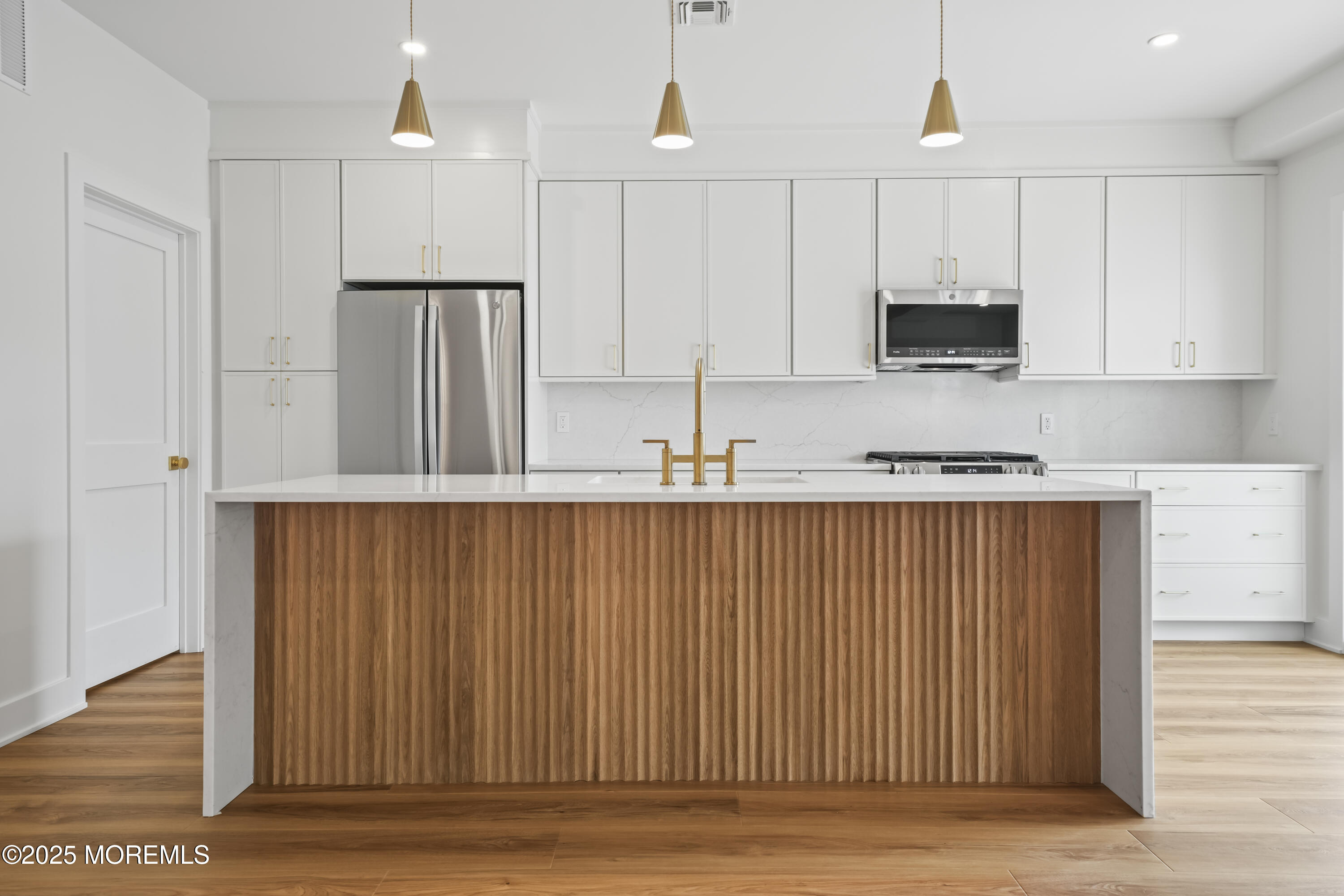 33 Hamilton Avenue, Unit 2 Seaside Heights, NJ 08751 - Photo 25 of 32 a kitchen with stainless steel appliances granite countertop a refrigerator sink and microwave