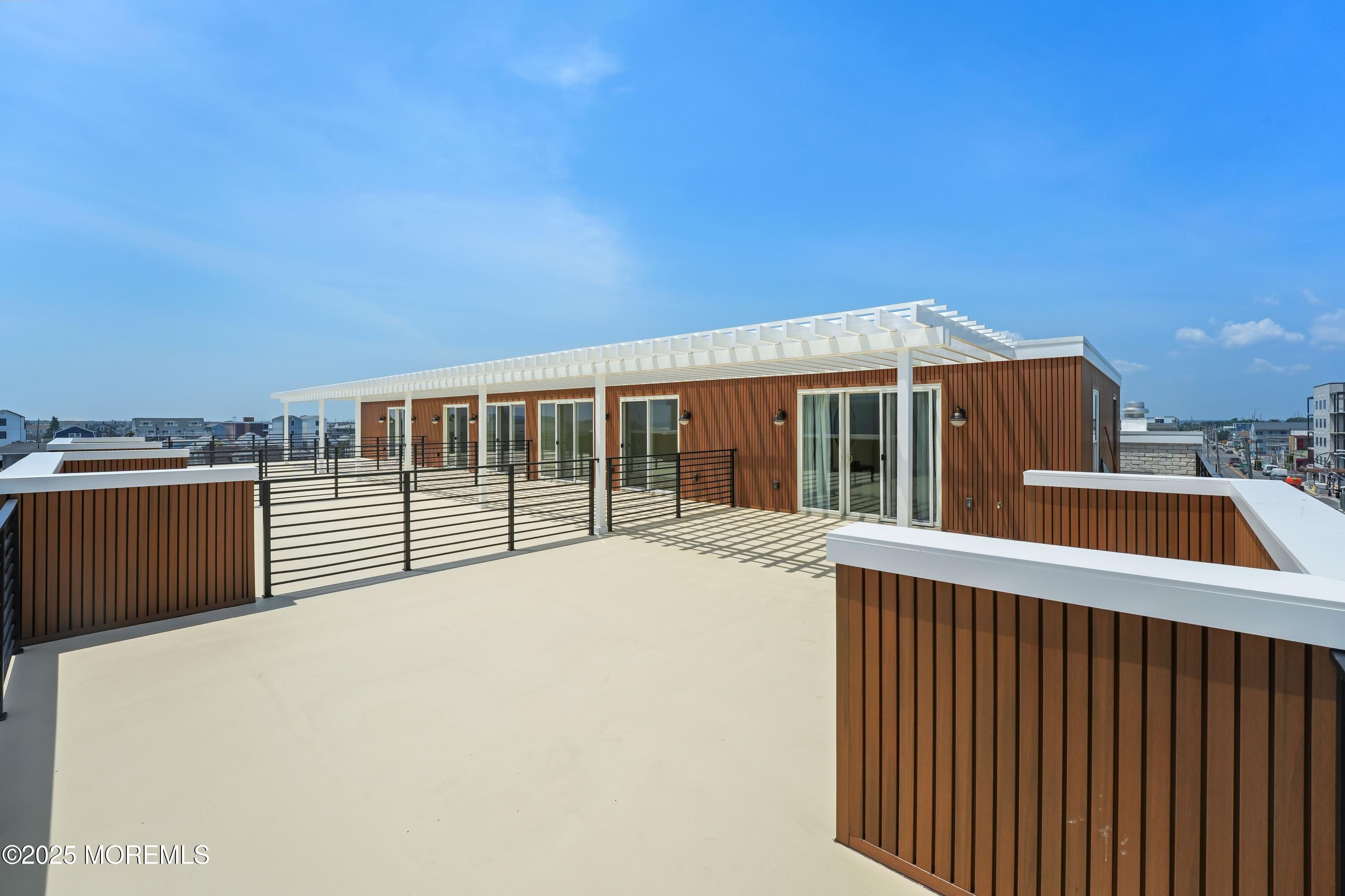 33 Hamilton Avenue, Unit 2 Seaside Heights, NJ 08751 - Photo 27 of 32 a view of a house with a roof deck