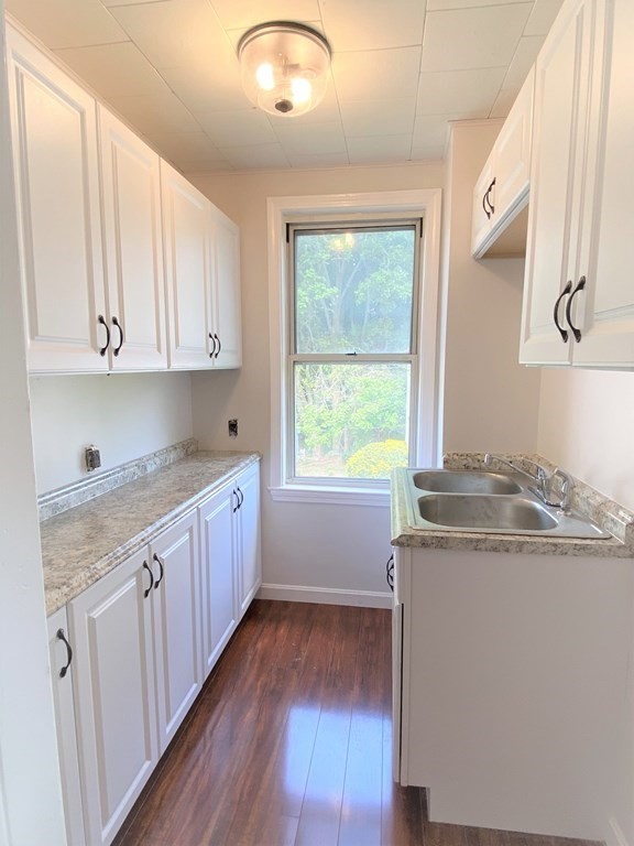 482 Snell Street Fall River, MA 02721 - Photo 2 of 41 a kitchen with granite countertop white cabinets and white appliances