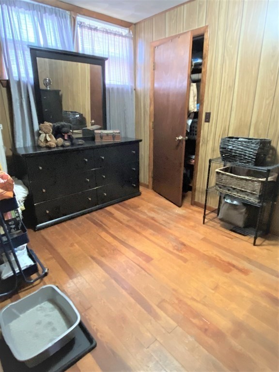 482 Snell Street Fall River, MA 02721 - Photo 22 of 41 a room with a bed and a mirror