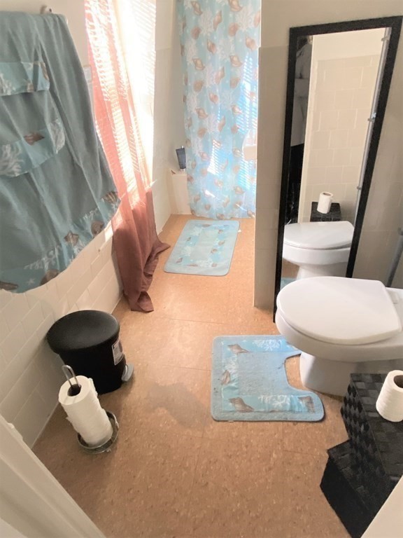 482 Snell Street Fall River, MA 02721 - Photo 29 of 41 a bathroom with a toilet and a mirror