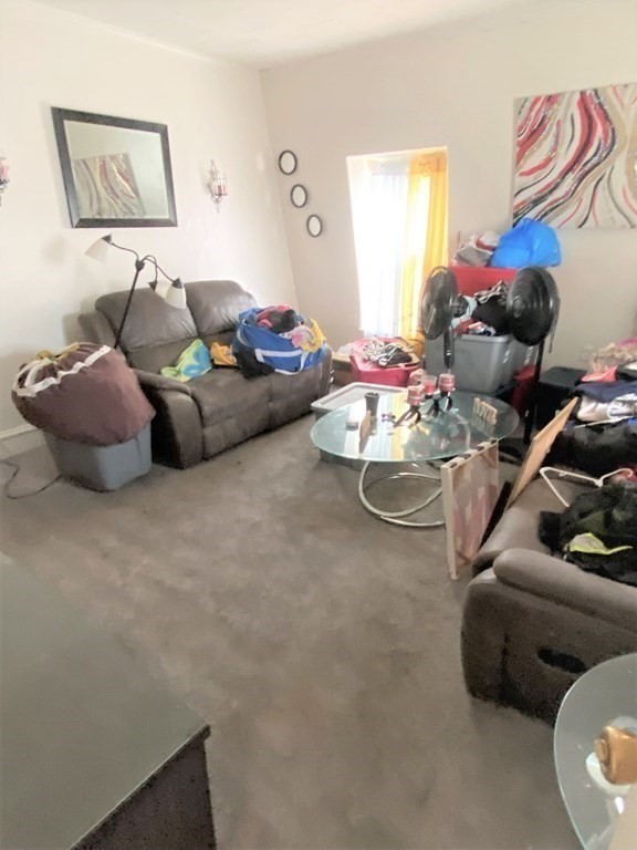 482 Snell Street Fall River, MA 02721 - Photo 32 of 41 a living room with furniture and a couch
