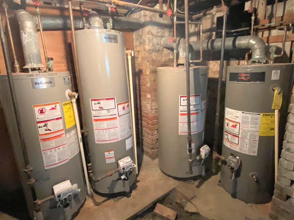 482 Snell Street Fall River, MA 02721 - Photo 40 of 41 a room with water heater and refrigerator