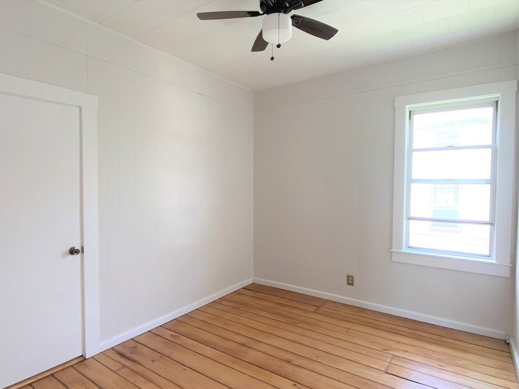 482 Snell Street Fall River, MA 02721 - Photo 5 of 41 wooden floor in an empty room with a window