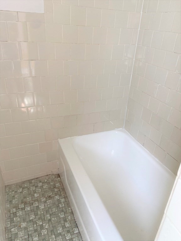 482 Snell Street Fall River, MA 02721 - Photo 9 of 41 a bathroom with a bathtub