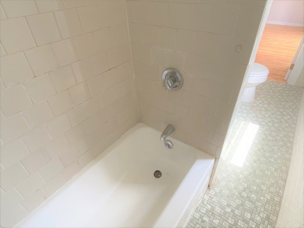 482 Snell Street Fall River, MA 02721 - Photo 10 of 41 a bathroom with a tub and shower