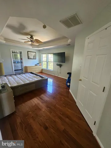 a bathroom with a glass shower door and a window