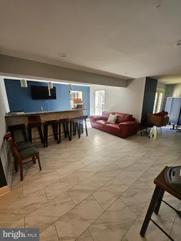 a bathroom with a sink toilet vanity and shower