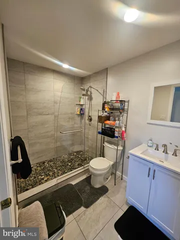 a kitchen with a stove a sink and a refrigerator