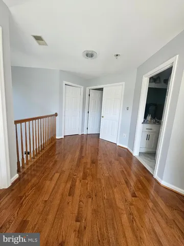 a bathroom with a double vanity sink toilet mirror and shower