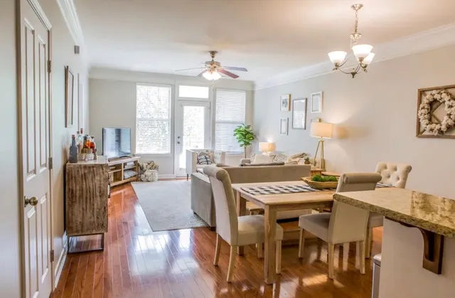 a view of a dining room with furniture window and wooden floor