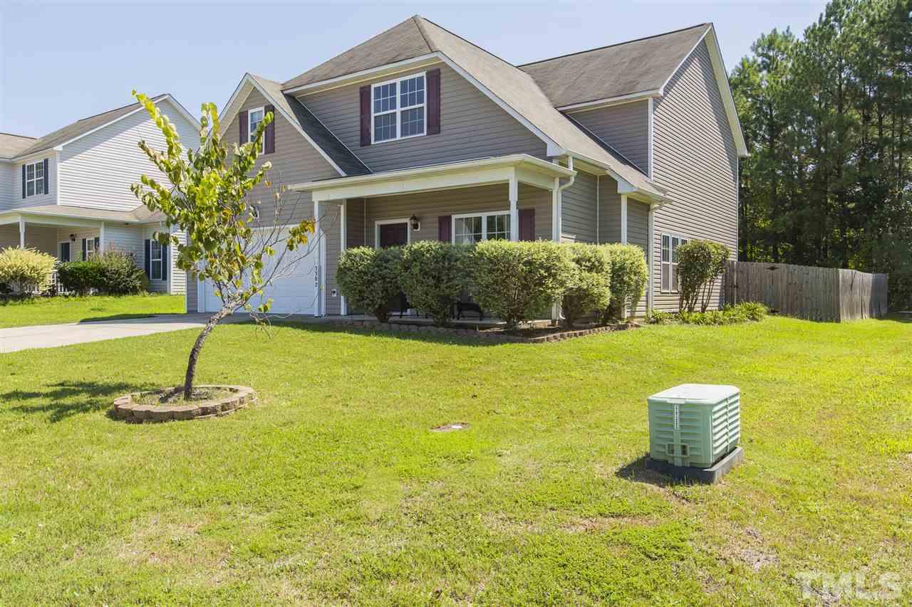5302 Interlock Drive Raleigh, NC 27610 - Photo 1 of 19 a view of a house with a yard and plants