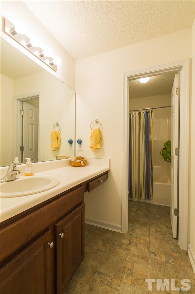 5302 Interlock Drive Raleigh, NC 27610 - Photo 16 of 19 a bathroom with a sink and a mirror