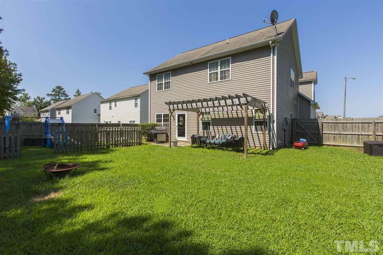 5302 Interlock Drive Raleigh, NC 27610 - Photo 3 of 19 a front view of a house with garden