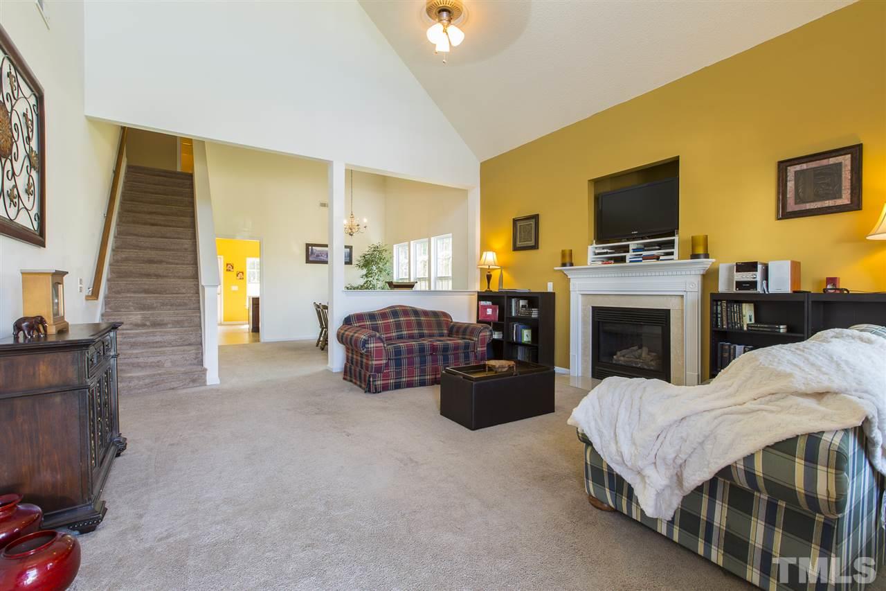 5302 Interlock Drive Raleigh, NC 27610 - Photo 4 of 19 a living room with furniture and a fireplace